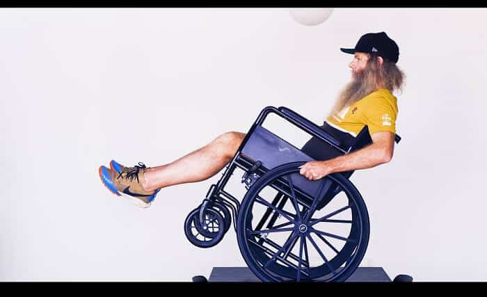 Shaun Gladwell presents ‘Homo Suburbiensis'. Balancing a wheel chair on a small dining table